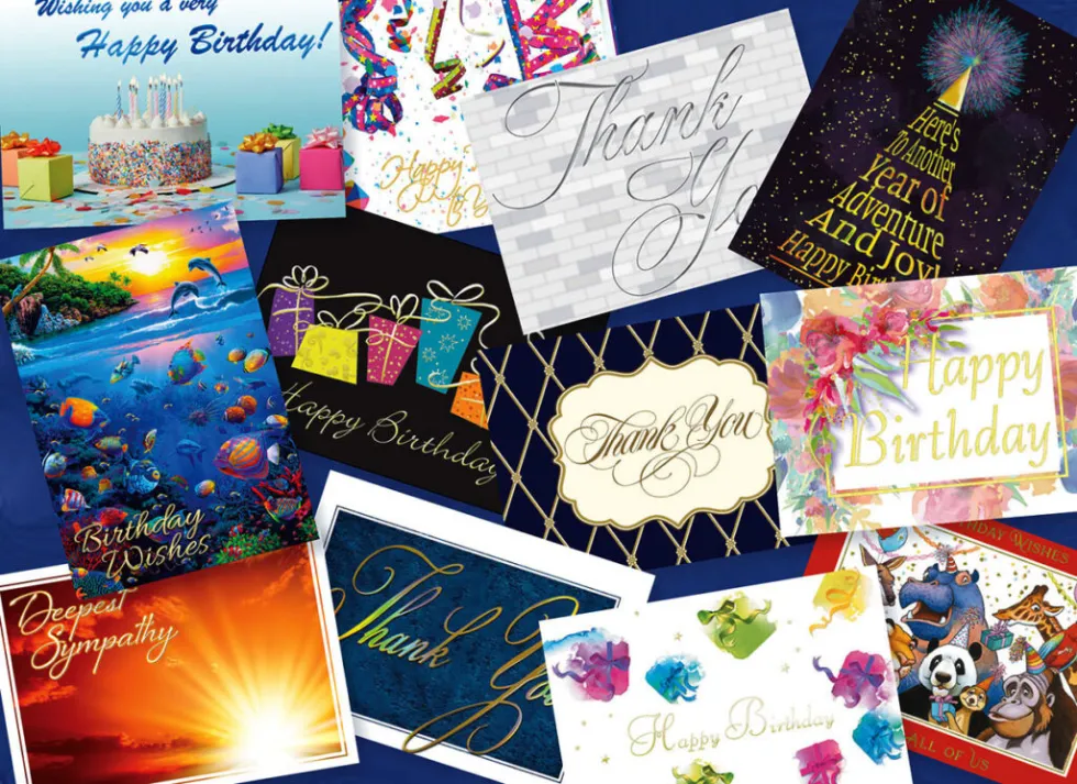 An assortment of all-occasion greeting cards spread out on a surface