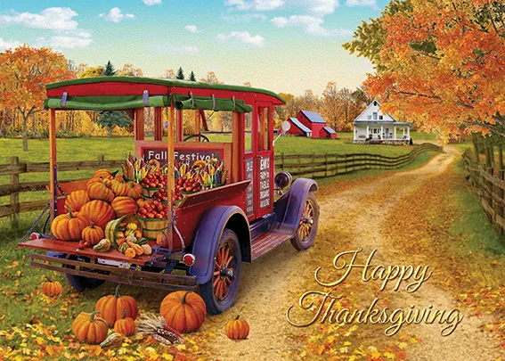 Thanksgiving card showing a vintage truck loaded with pumpkins on a farm lane, reading Happy Thanksgiving